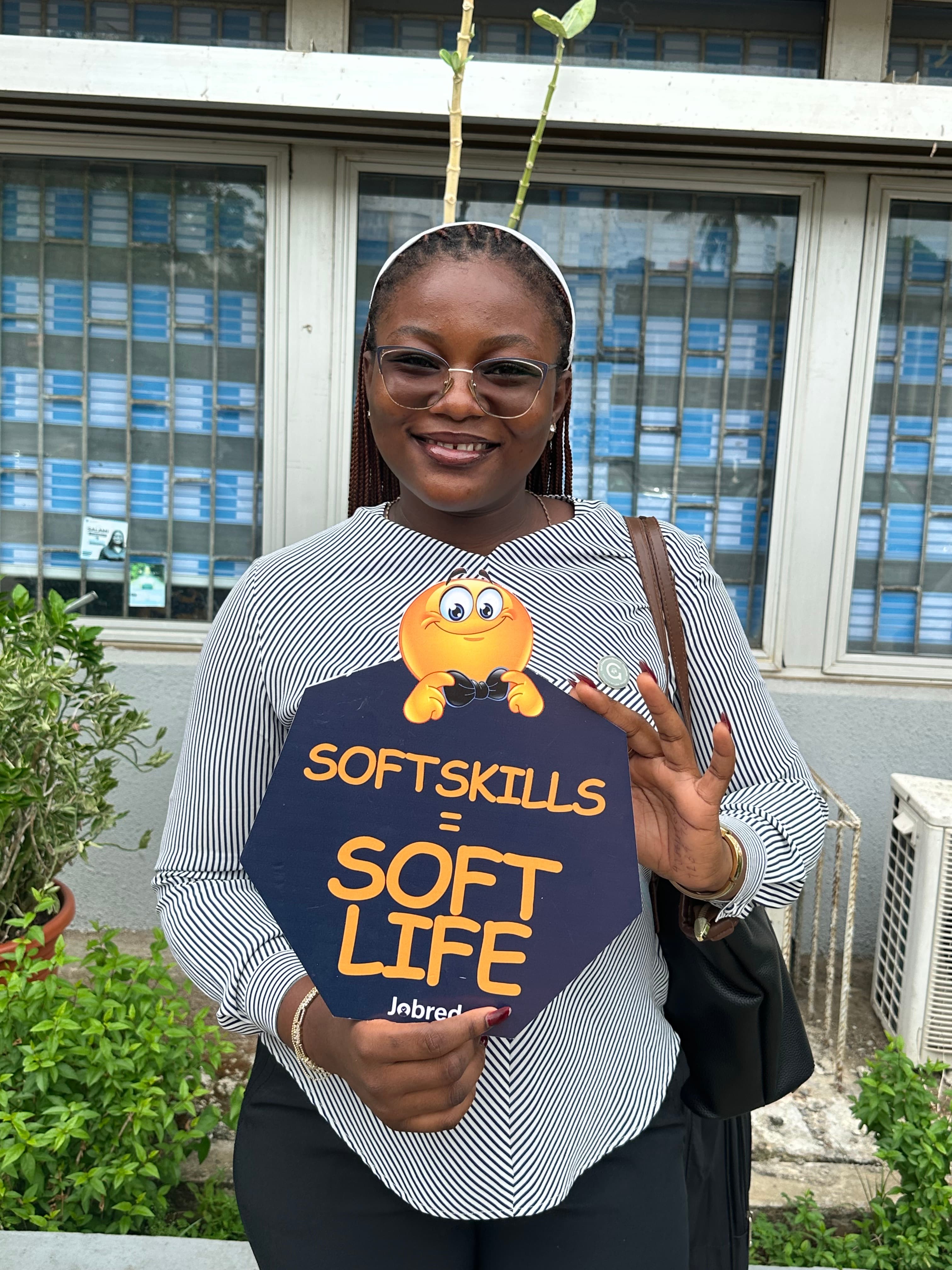 A JobRed participant smiling outside a training venue